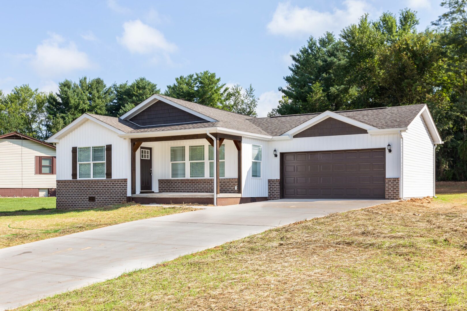 Exterior front of a home with a garage and driveway.